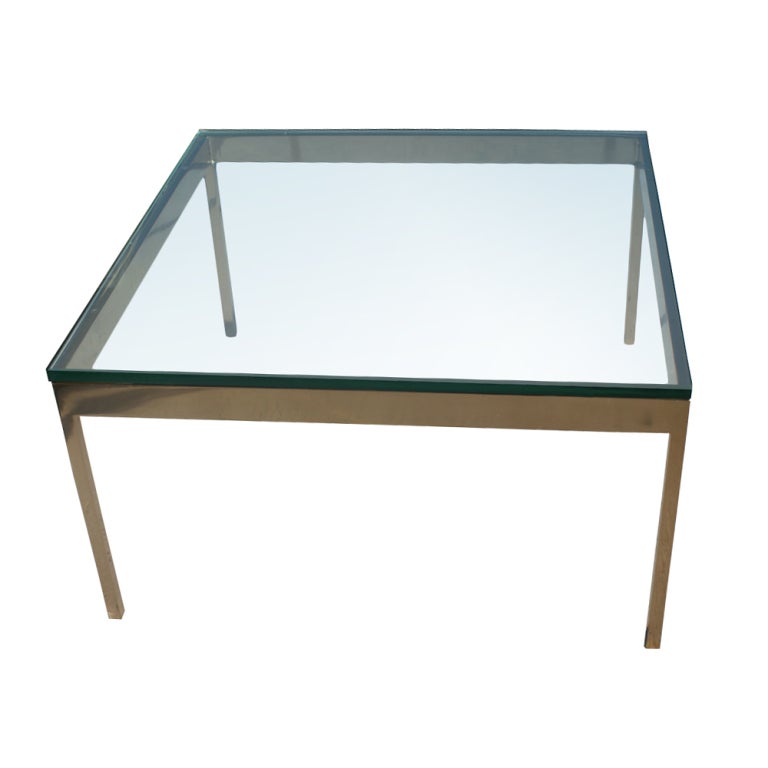 A square modern coffee or large end table with a solid bronze base and 3/4