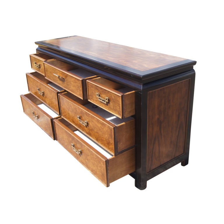 An Asian motif dresser made by Century Furniture and part of their Chin Hua line.  Ash burl construction with ebonized maple edges and bronze hardware.