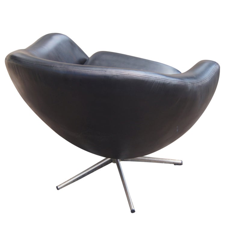 A mid century modern pod chair made in Sweden by Overman.  New black leather upholstery on a five star swivel base.  As shown in the last image, we also have a matching sofa listed on 1stdibs.