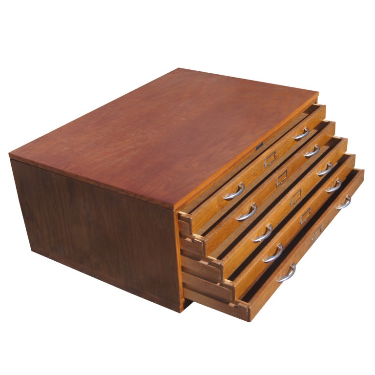 A vintage flat file made by Mayline in oak with five drawers.