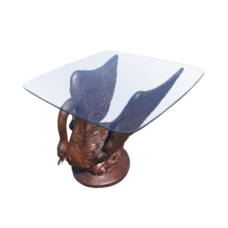 A dining table base in the form of a swan which could accomadate a piece of glass approximately 80