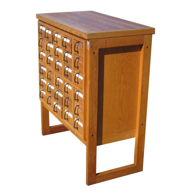 Super unique oak, library card catalog file. This cabinet features metal drawer pulls and dovetail construction. File is very sturdy and well-made. Card file missing the rods for index cards

Drawer: 16.5 D x 5.75 W x 4