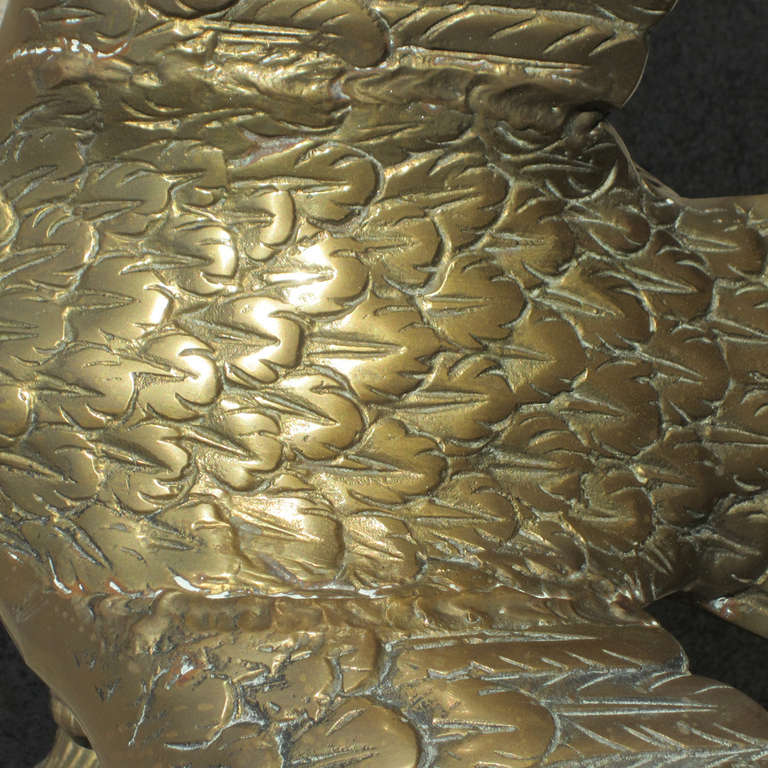 Mid century modern bronze sculpture of an eagle about to take off. Finely detailed, with almost no wear or patina. A bold, beautiful conversation piece for any home or living room.
