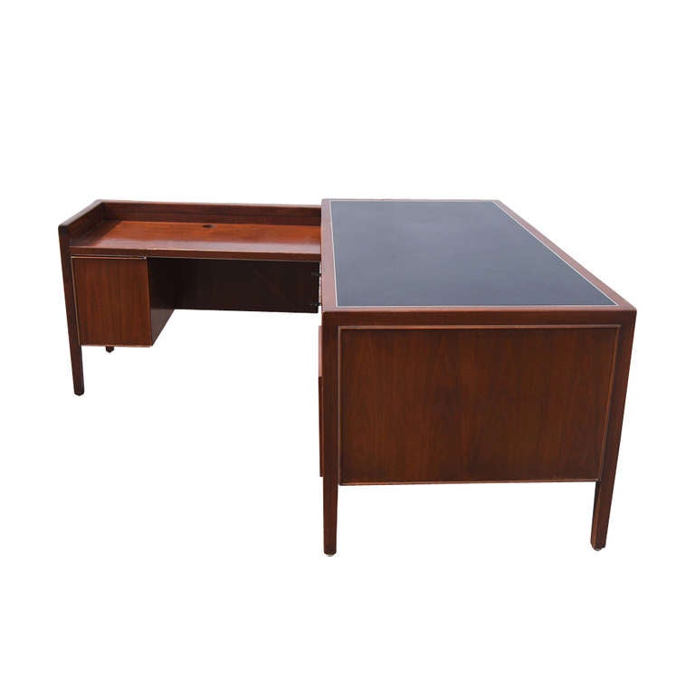 A great Stow Davis leather top wood desk. This amazing pieces features one standard drawer, one large file drawer, and one file drawer with slots. The top is lined with black leather. A great addition for you office or home office. 

Desk- 66