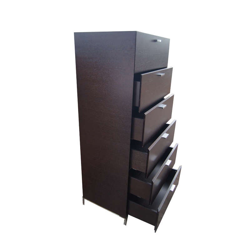 Tall six drawer bureau made in Italy.  Ebonized wood with stainless steel hardware.