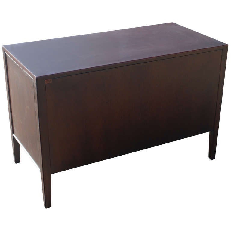 A superb Stow Davis credenza constructed of solid wood, newly restored. The credenza features two file drawers, two regular standard drawers and chrome handle pulls. 

Two credenzas total are available; please inquire. Price is per cabinet.