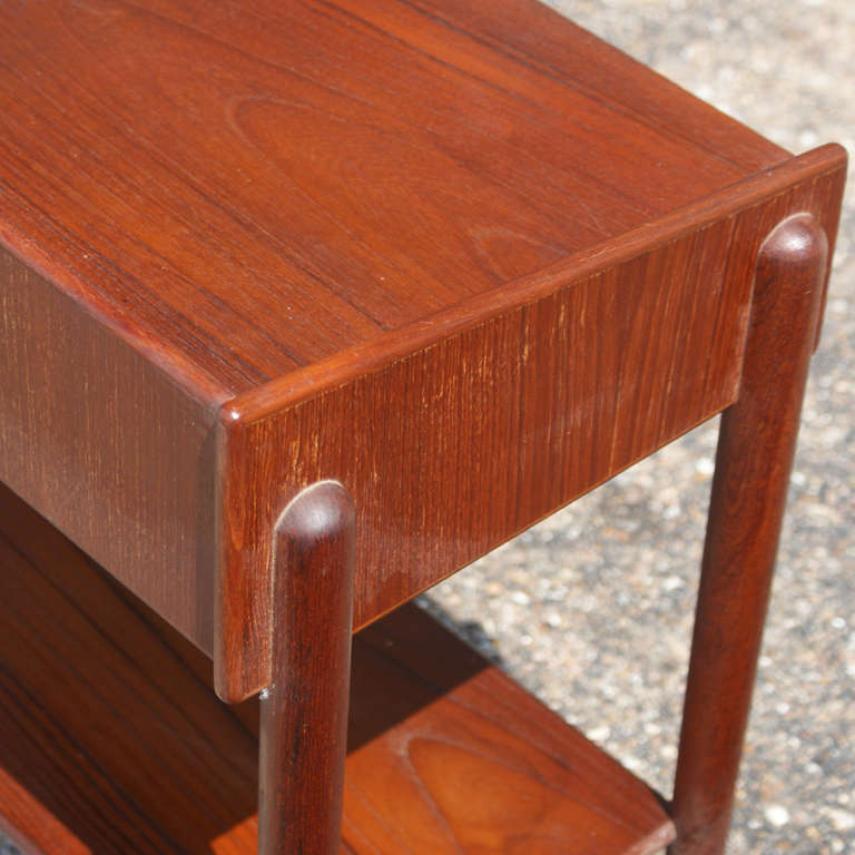 A beautiful, Danish Modern Mahogany end table that can be used as a night stand. The table features a two tier function.