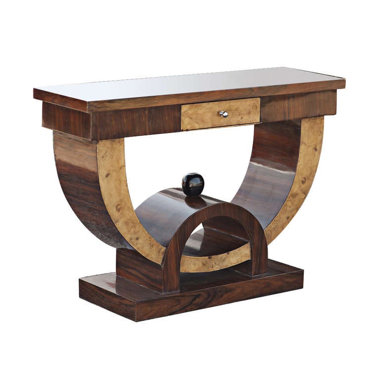 A rosewood and burl wood console with exuberant Art Deco style lines and contrasting woods.