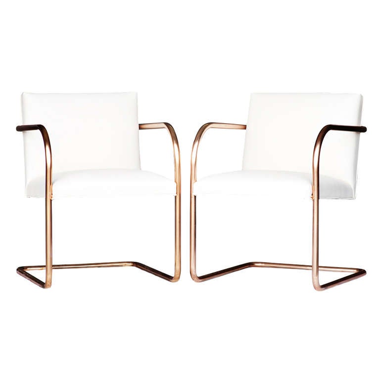 A set of eight Mies van der Rohe copper and leather chairs for Thonet.  Upholstery is new, in an off white leather.  Tubular seamless steel frame is copper finished.  

Complete dimensions are: 
21.5