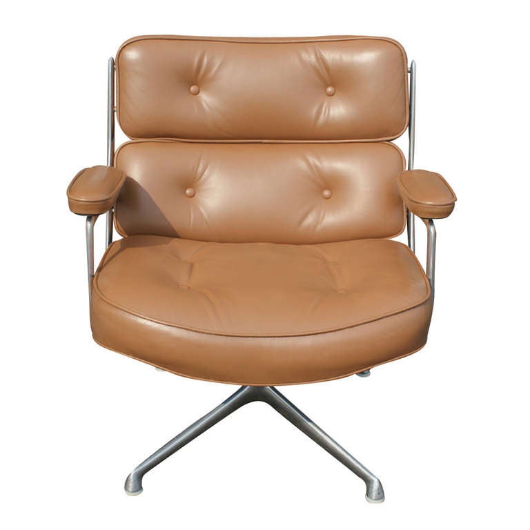 The elegant Time Life Executive Chair is made of high quality materials featuring an aluminum base and frame. Upholstered with a nice, caramel leather with deep cushions, padded arms, and a swivel mechanism. 

The ottoman features the same