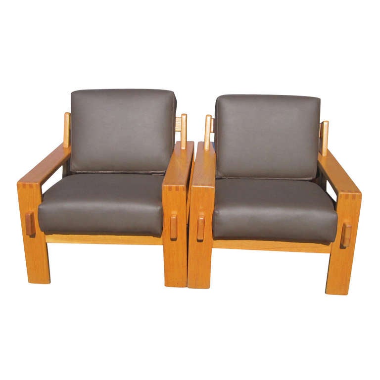 Two Bonanza Lounge Chairs manufactured by Asko of 
Finland and designed by Esko Pajamies 

Mortise and tenon detailing and decorative dovetailing.  The cushions are newly upholstered in a high-end Italian Ultra leather.