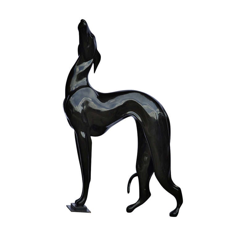 An amazingly beautiful and graceful, black greyhound sculpture. Could be used as an accent piece or displayed as a sculpture.