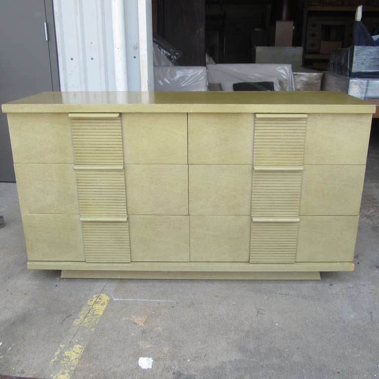 A vintage midcentury pale green credenza manufactured by Kent Coffey as part of the Woodmaster series. This large dresser has six spacious drawers with slatted handles and joined together with dovetail joints. This classy piece would be a great