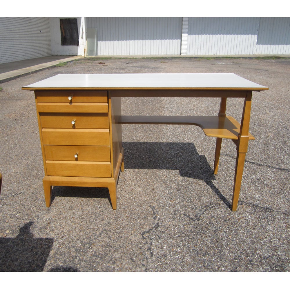 A 48" Vintage Heywood Wakefield Cadence Desk Vanity. This desk/vanity features a single pedestal design, stylish lower shelf and laminate top. A great example of classic Heywood Wakefield style and substance. Very nice example of this hard to