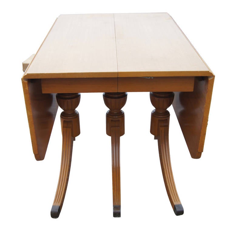 A vintage Rway dining table with drop leaf sides.  At nearly five feet when fully spread, this piece can compact into a three foot table. Made of mahogany, sturdy and classic.