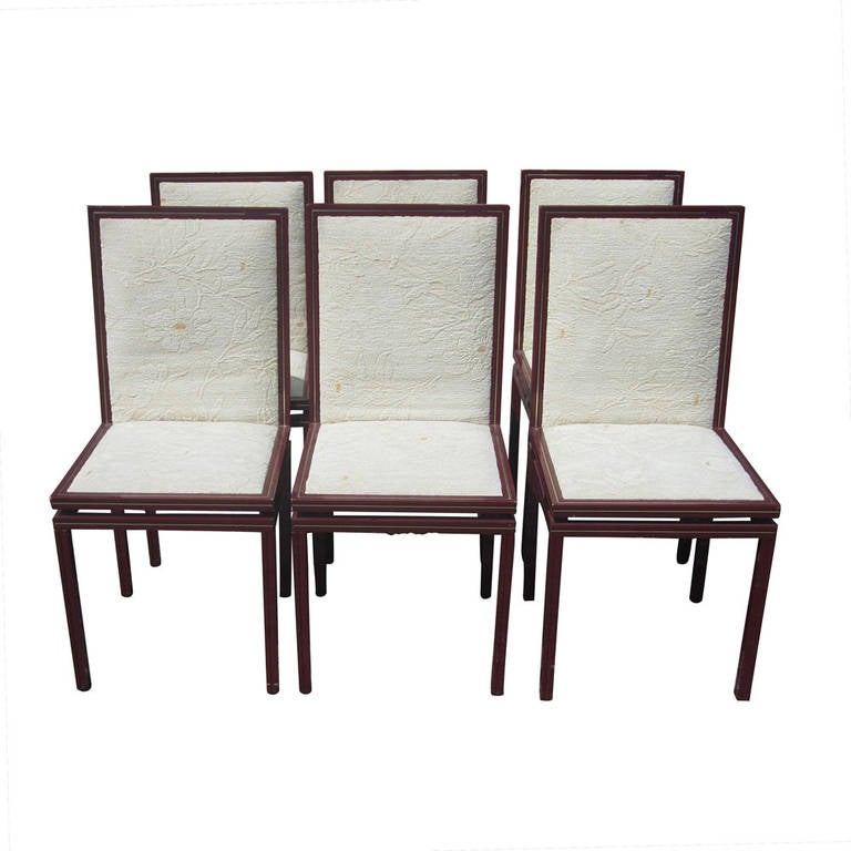 A set of French vintage dining chairs designed by Pierre Vandel. Original upholstery and frames are coated aluminum and brass detail with a rich finish.
