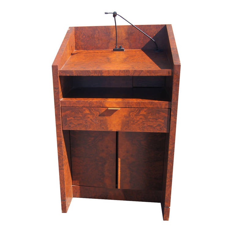 Burled rosewood veneer with a dark stain.
Microphone included.
(1) Pull-out drawer.
(2) Cabinet doors.