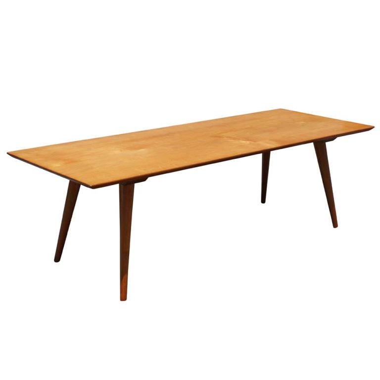 A mid century modern coffee table designed by Paul McCobb and made by Winchendon. It features the simple lines and maple construction of Winchedon's Planner Group series.