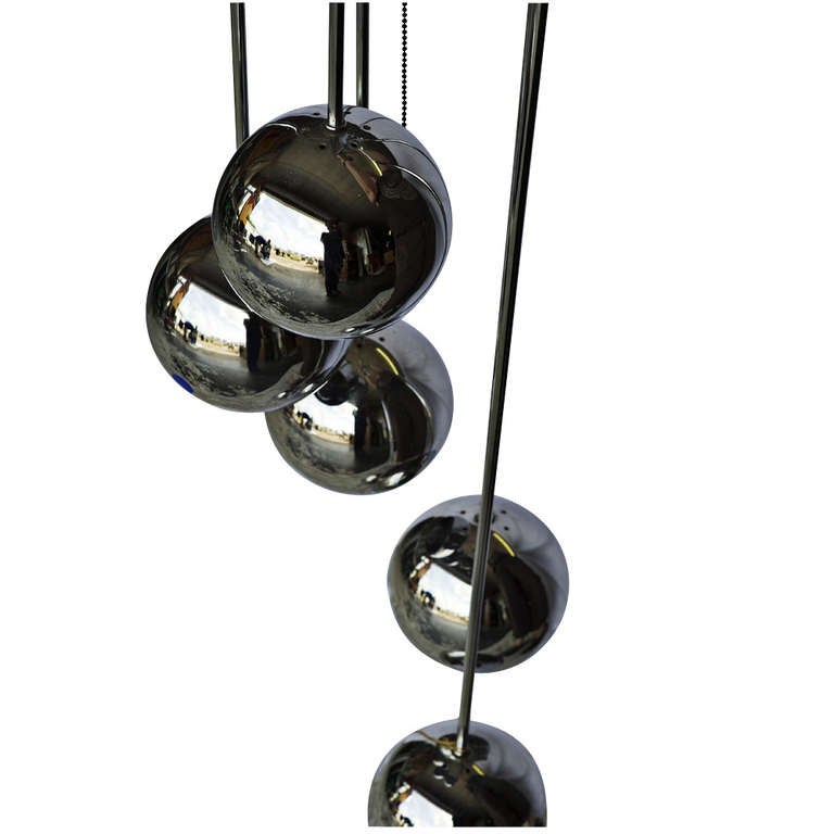 Space Age chandelier light consisting of five chrome 
globe pendants hung at graduated lengths

Two prong plug

Circa 1960's