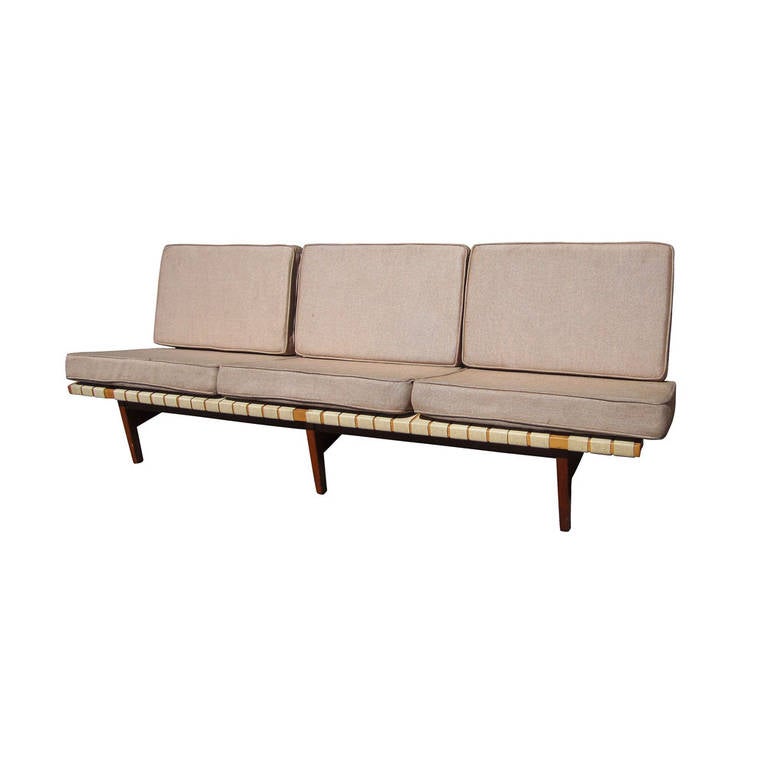 Vintage maple frame Knoll sofa by Lewis Butler for Knoll. An arm-less sofa with walnut back legs, cotton web seats and back support. A great example of classic Knoll style and substance, perfect for any home or living space. Measures 81