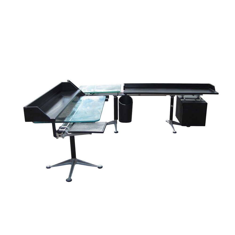 A vintage Burdick modular desk for Herman Miller. This desk has multiple functions and features; a file drawer is suspended from the beam and can easily be removed. This desk is comprised of two glass pieces, one square and one rectangle; the glass