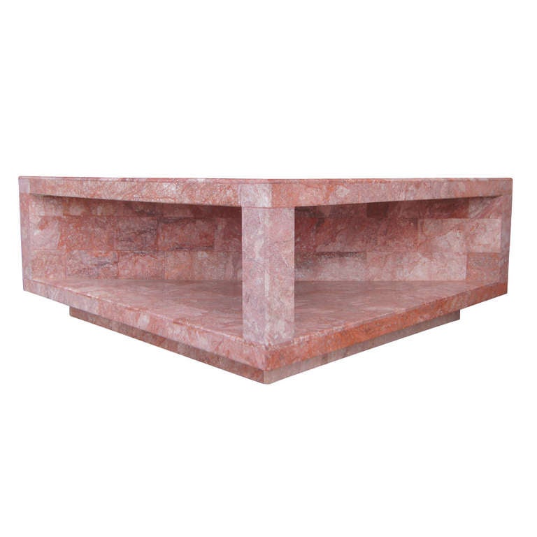 Heavy construction with diagonal tier for decoration, tea set or magazines.  
Nice art sculpture for any room.