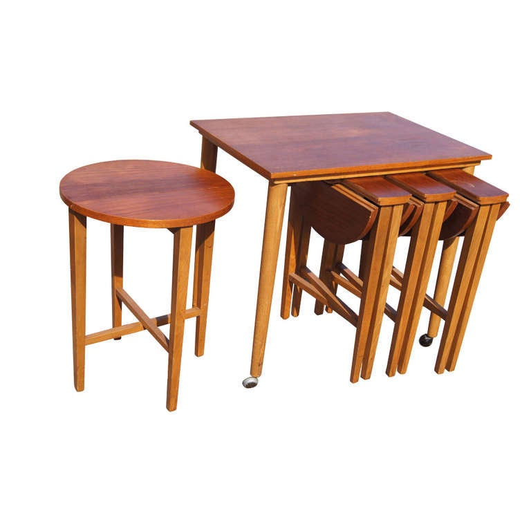 Sleek, solid design and very functional. 
Can be used as occasional tables, serving tables or nightstands. Easily moving around with caster. 
Teak wood.