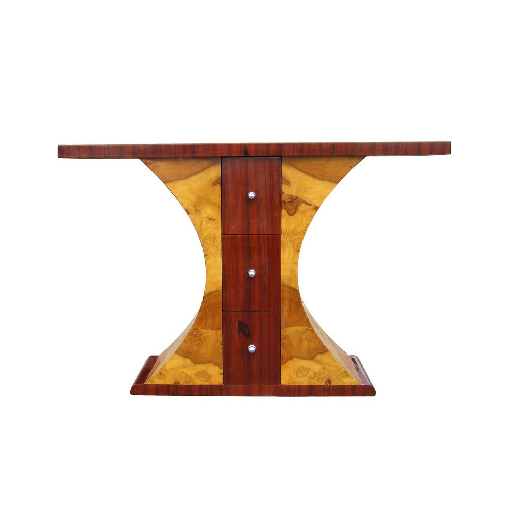 A unique, stunning console table constructed of two wood materials, walnut and burl, with three drawers and metal pulls. A stylish piece sure to complement any bedroom or living space.