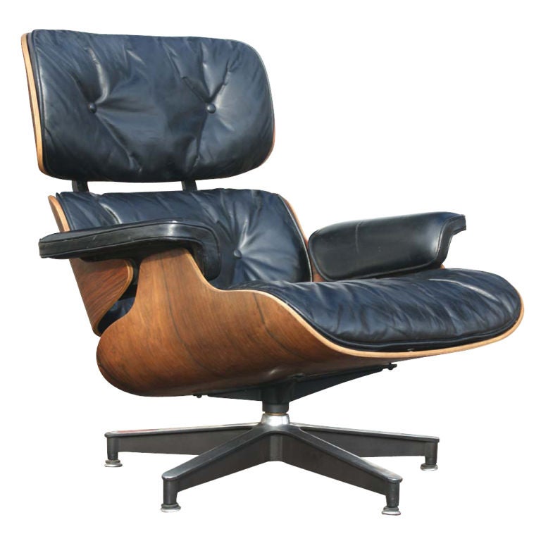 A rare early lounge chair and ottoman designed by Charles and Ray Eames for Herman Miller.  Rosewood with down filled cushions and a rare swivel ottoman.  A classic of mid century modern design.