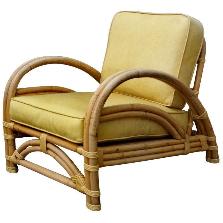 A Mid-Century Modern lounge chair by Ritts Tropitan, designed by Herb Ritts. Rattan frame with the original vinyl upholstery. Reupholstery is available in the customer's own material at no additional cost.