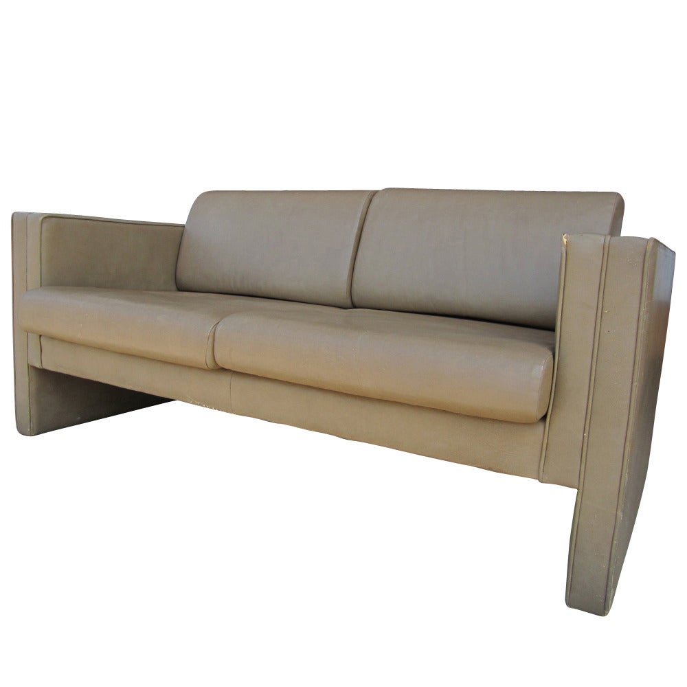 A gray-brown two-seat leather sofa made by Brayton. This sofa is designed to be solid and provide maximum comfort.  