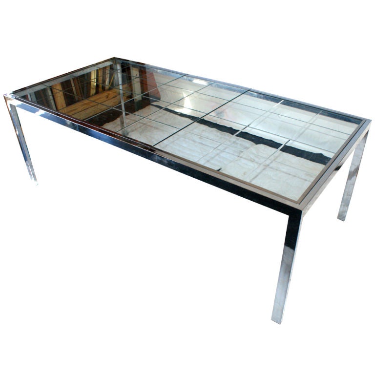 A mid century modern dining table designed by Milo Baughman and made by Thayer Coggin.  Chrome frame with a mirrored lattice top.  A 20