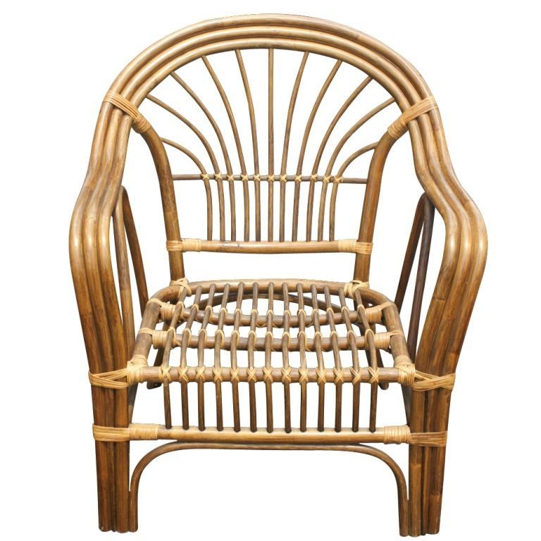 A pair of bamboo and rattan lounge chairs made by Ritts Tropitan reminiscent of the style of Paul Frankl.  We also have several matching pieces of bamboo furniture available on 1stdibs, as shown in the last image.