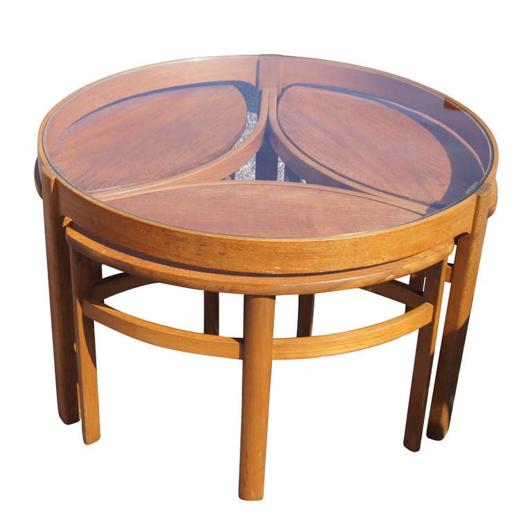 Solid oak and glass construction.  32" 1/4 Round coffee table with 3 leave occasional table nesting underneath. 
Leave size: w24.5" x d13" x h17"  Very functional and beautiful for small space.