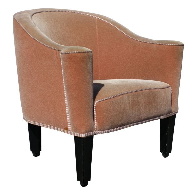 A Vienna Secessionist lounge chair designed by Josef Hoffmann and made by Wittmann of Austria. Originally designed for the Villa Gallia in 1913, this is a licensed chair from the latter part of the twentieth century. Salmon colored velvet with