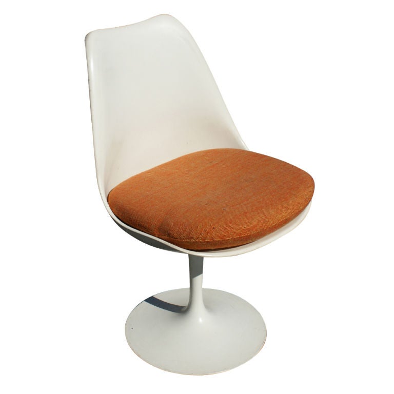 A set of six mid century modern dining or side chairs designed by Eero Saarinen and made by Knoll.  Cast aluminum base with a white scratch-resistant rilsan coating.  White fiberglass seat and back with original cushion.