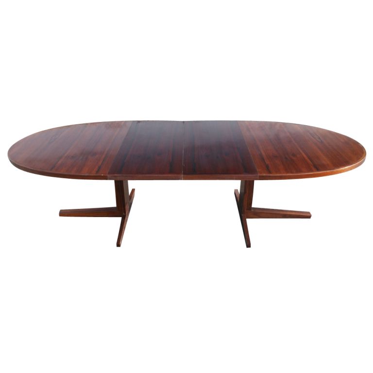 A mid century modern dining table designed by John Mortensen and made by Heltborg Mobler.  Rosewood with palisander additions.  Two 20