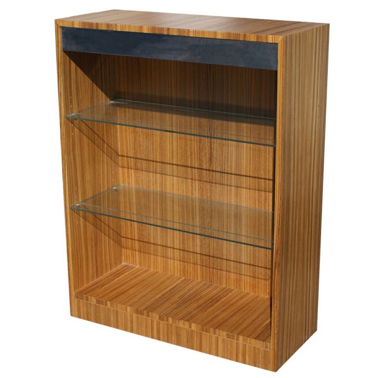 A set of mid century modern furniture designed by Milo Baughman, made by Thayer Coggin:  A cabinet in rosewood with two ebonized shelves and two shelf or display units with chrome reveals and glass shelves.  
Same dimensions for 3 units, except 1