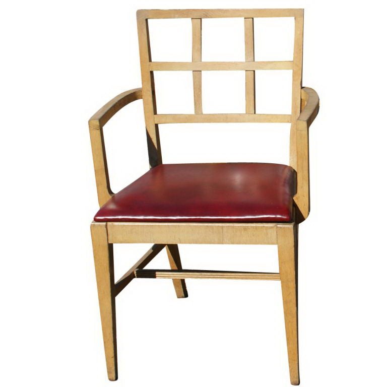 A set of two dining chairs designed by T.H. Robsjohn-Gibbings and made by Widdicomb.  Bleached mahogany frames with red seats.  One armchair and one side chair.