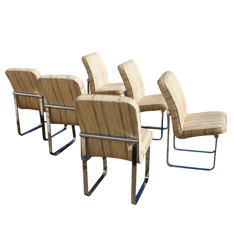 A set of six mid century modern dining chairs made by Design Institute of America by Milo Baughman.  Flat bar chrome frame.

Reupholstery recommended.   
