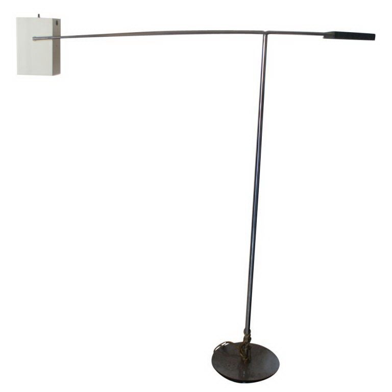 A mid century modern floor lamp designed and made by George Kovacs.  Square white enamel, pivoting shade on a weighted, rotating swing arm that makes the light fully adjustable.  Round 10