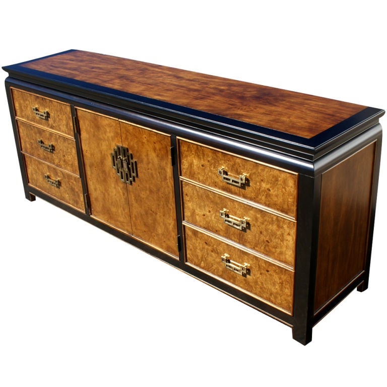 A dresser made by Century Furniture from their Chin Hua' An line. Ebonized maple with burled ash fronts in an Asian design.  Six drawers with decorative bronze pulls and three drawers behind double doors.  As shown in the last image, we also have a