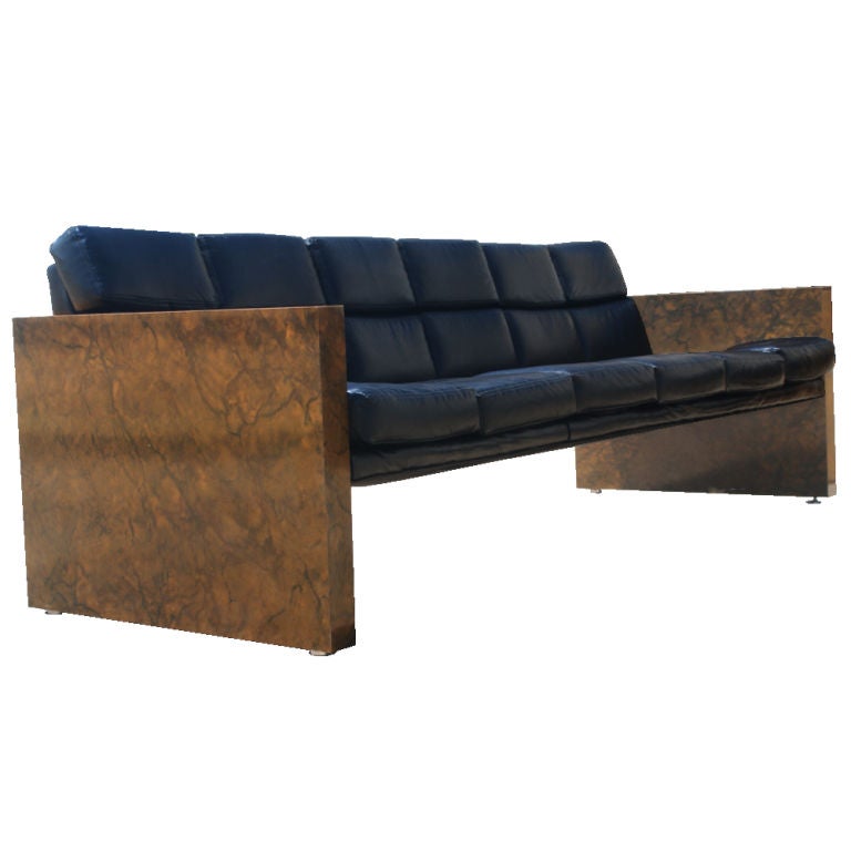 A pair of mid century modern sofas designed by Milo Baughman and made by Thayer Coggin.  Tortoise shell laminate ends with black vinyl cushions and back.  As shown in the last image, we also have a matching Parson's table listed on 1stdibs.