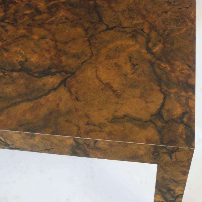 A mid century modern Parson's table designed by Milo Baughman and made by Thayer Coggin in tortoise shell laminate.  As shown in the last image, we also have a matching pair of sofas listed on 1stdibs.