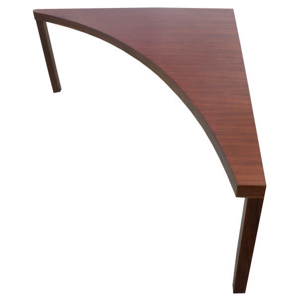 Corner sofa table with 'boomerang' top constructed of solid walnut.