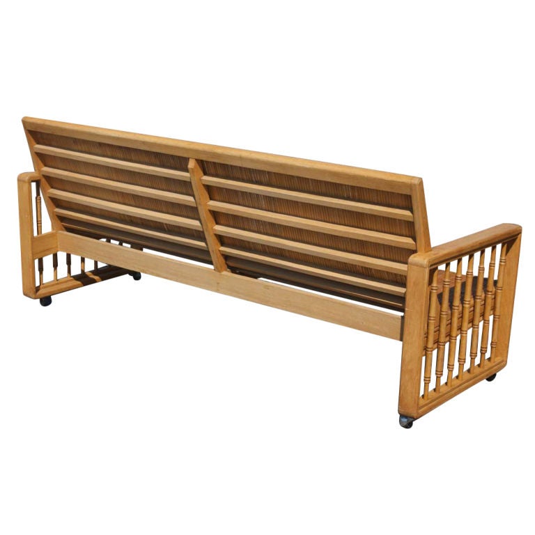 Vintage Split Bamboo Sofa Couch on Casters. Very high quality construction and in very good condition. We also have two matching side tables, a coffee table and four lounge chairs (not included in this listing).