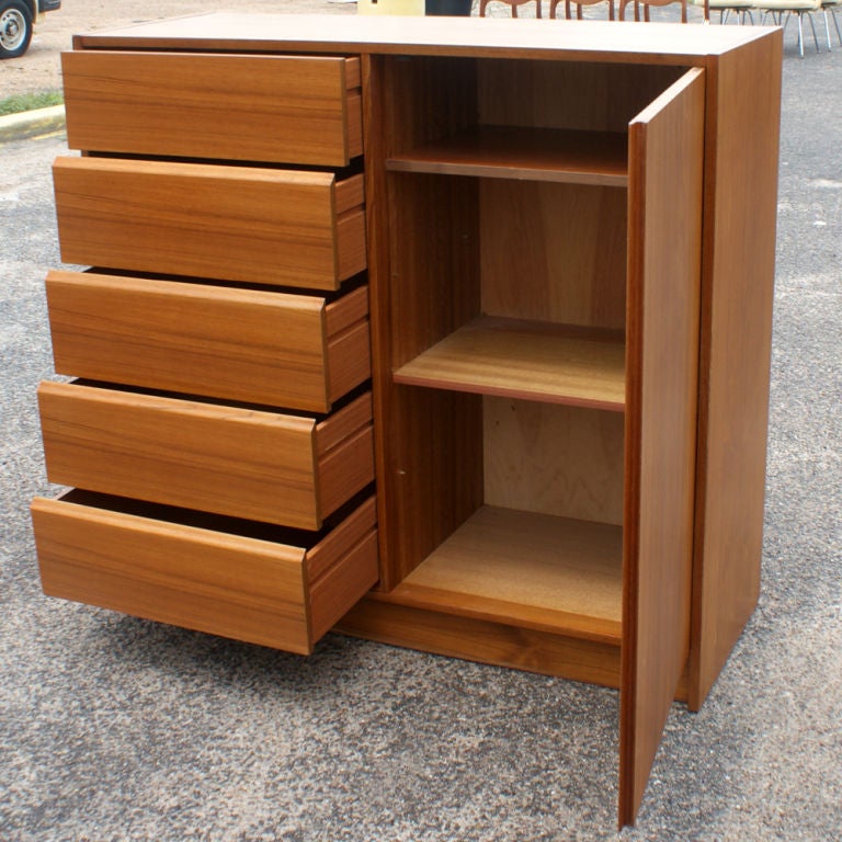 A fine vintage teakwood 5 drawer dresser with cabinet.