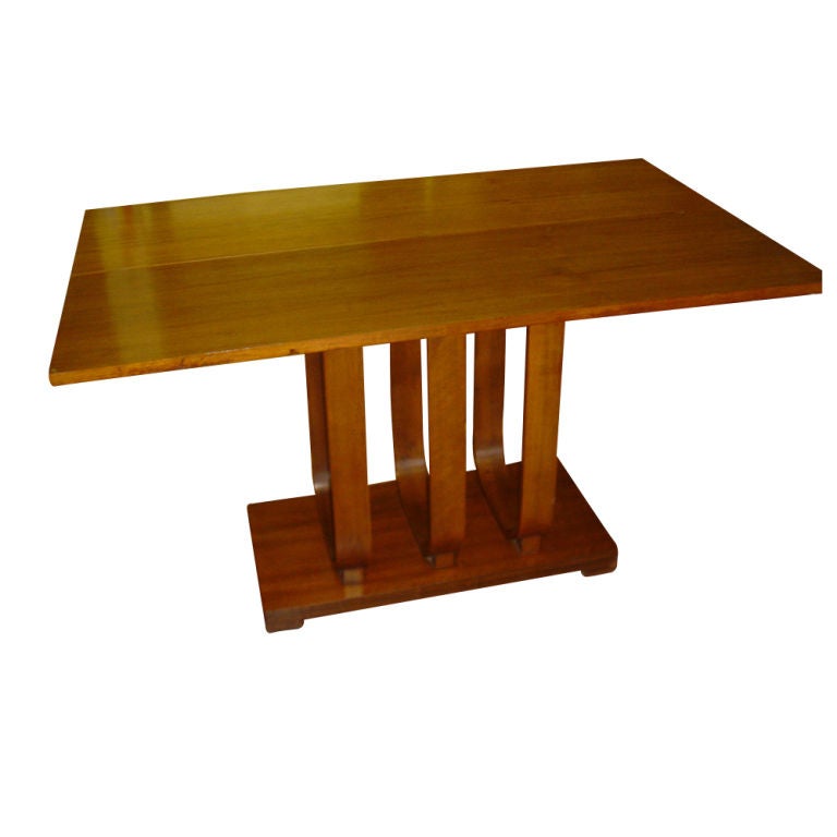 A rare Art Deco console or dining table designed by Gilbert Rohde and made by Heywood Wakefield.  With the top closed the table may be used against the wall as a console table and measures 50