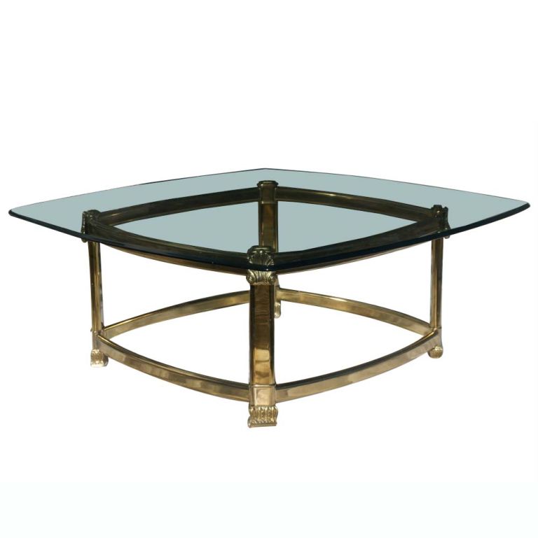 A neo-classical style coffee table made in Italy with a brass base and square glass top.