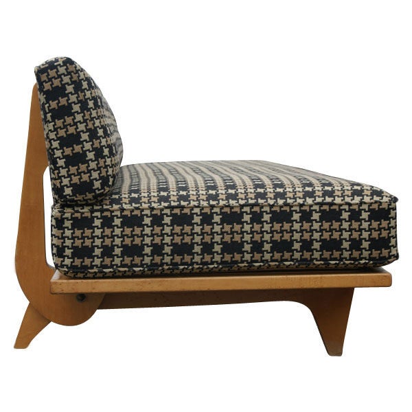 A mid century modern sofa and daybed designed by Richard Stein and made by Knoll in the late 1940's.  Maple frame with a foot lever that lowers the back for use as a bed.  Newly upholstered in a 1940-50's style patterned fabric.